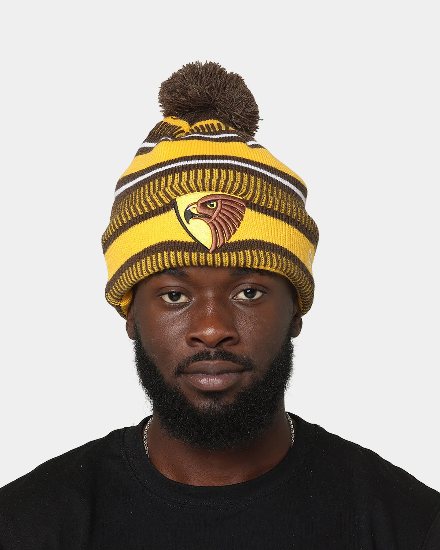 New Era Hawthorn Hawks AFL Opening Bounce 2022 Pom Wordmark Beanie Brown