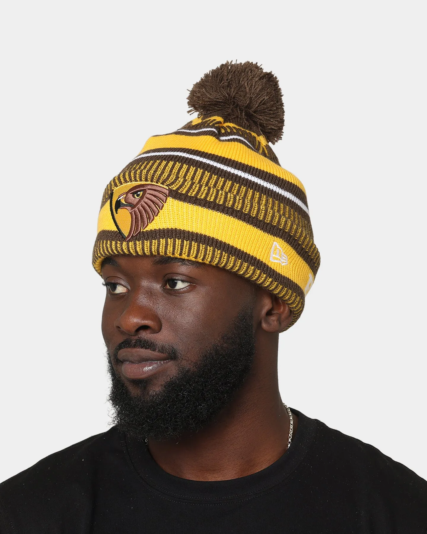 New Era Hawthorn Hawks AFL Opening Bounce 2022 Pom Wordmark Beanie Brown