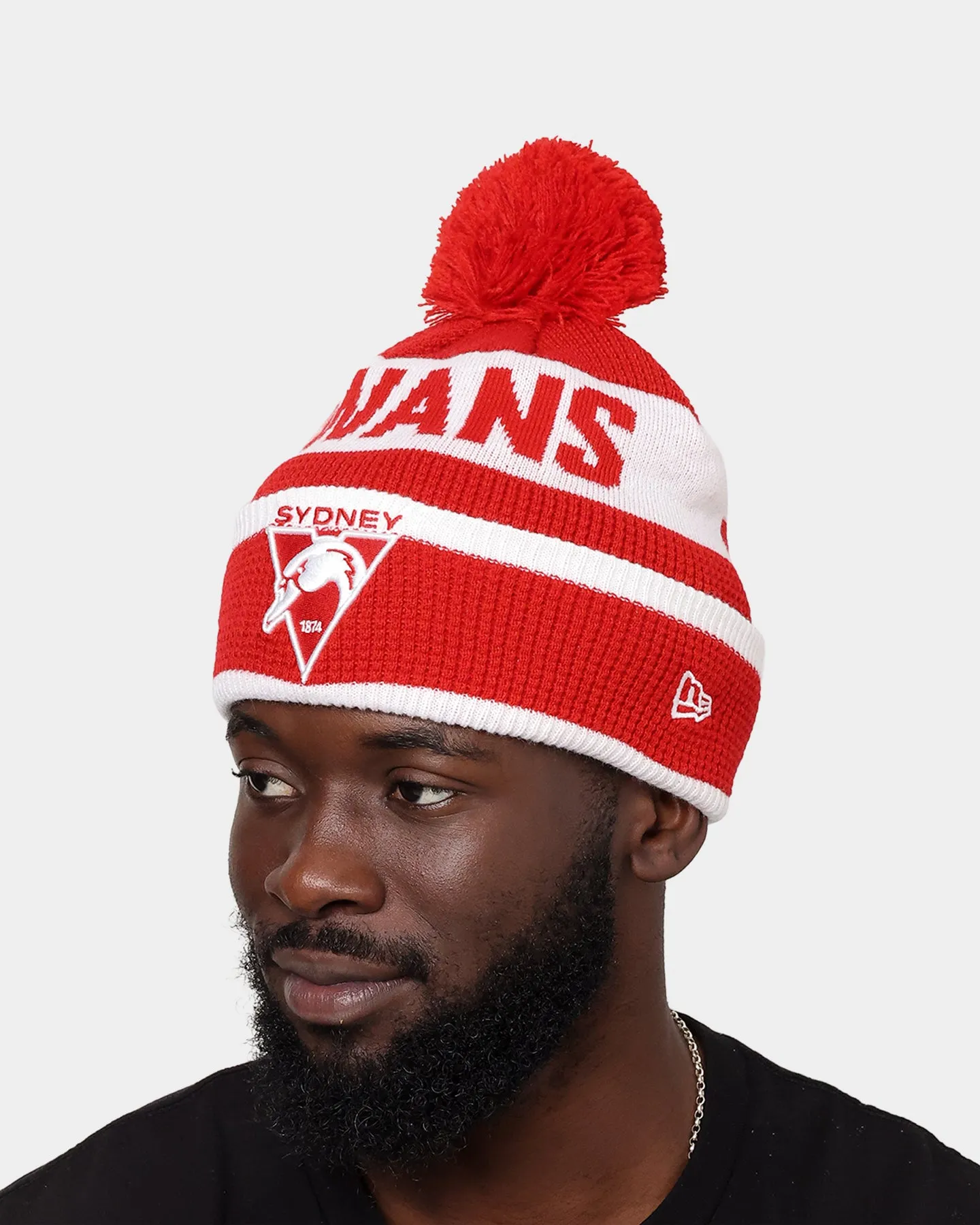 New Era Sydney Swans AFL Opening Bounce 2022 Pom Waffle Wordmark Beanie Red