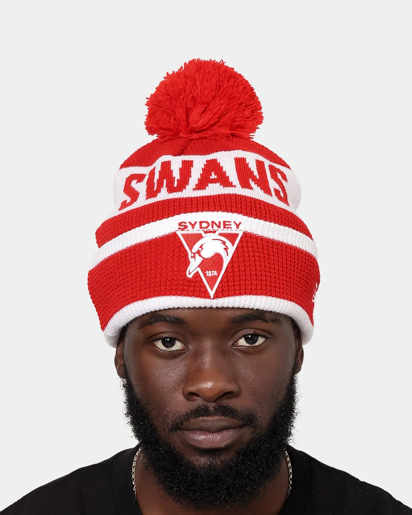 New Era Sydney Swans AFL Opening Bounce 2022 Pom Waffle Wordmark Beanie Red